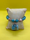 "Handmade Burmese Jade and Yellow Sunstone beaded bracelet with silver sunflower charm, String & Soul"